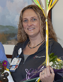 Katie DeMitry with balloons flowers