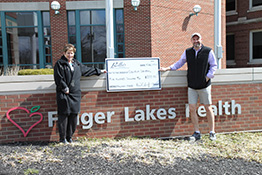 Photo of Richard & Helen holding check